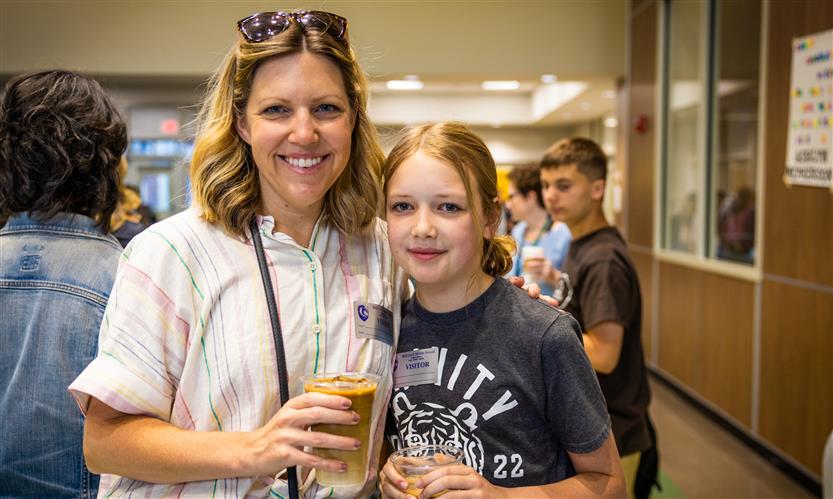 A School Board members stands with her daughter
